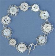 08-060821-Vintage_button_and_silver_wire_stitched_bracelet